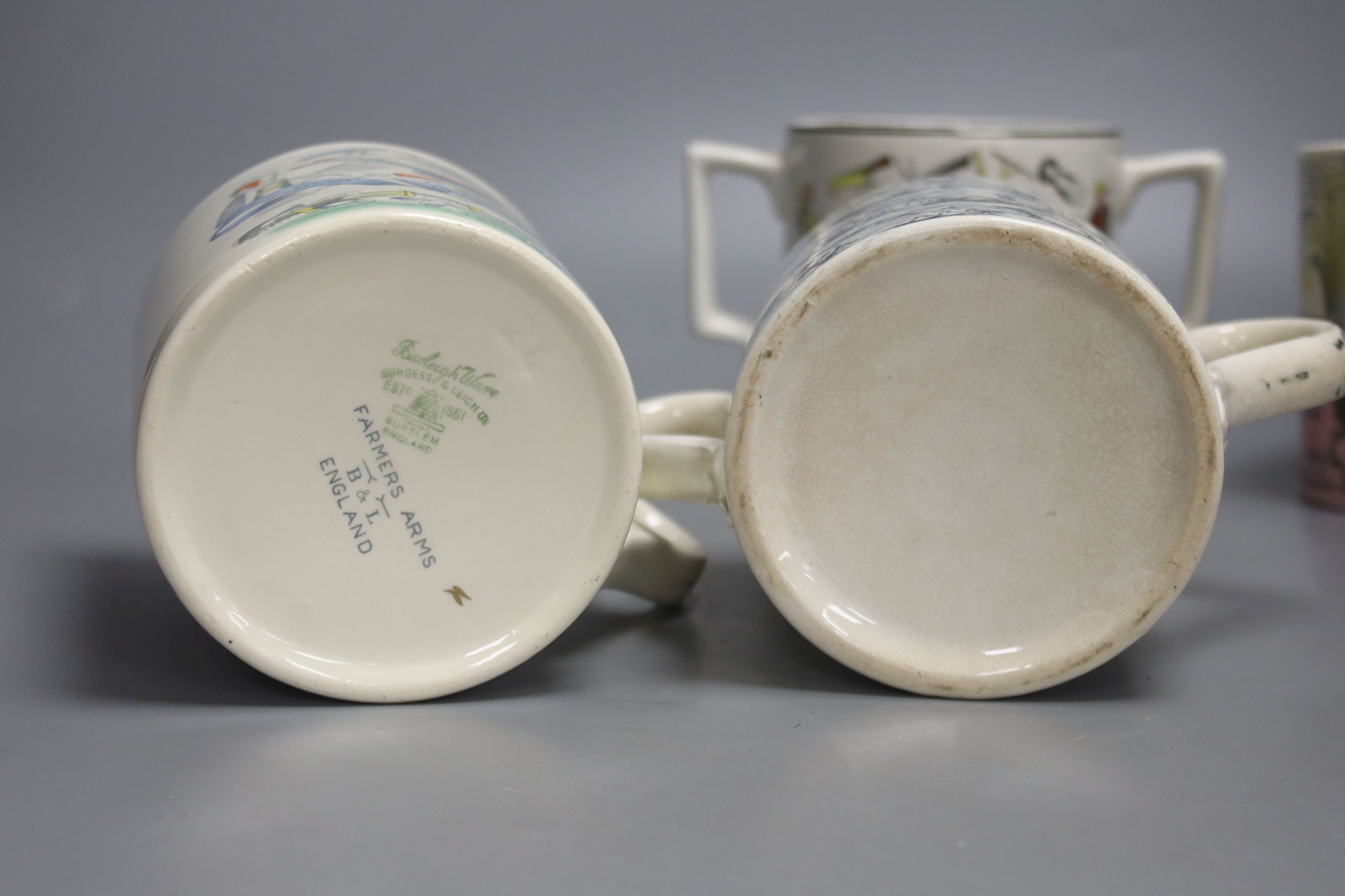 An Eric Ravilious Elizabeth II coronation mug and three 'speed the plough' mugs